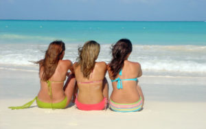 Keep your hair healthy while soaking up rays at the beach. Find out how at www.LuvlyLongLocks.com.